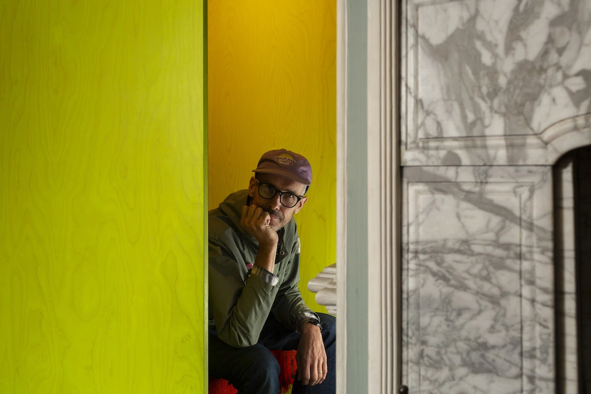 Michael Marriott inside his seating installation as part of Please Sit at Fenton House. Photo credit: Oskar Proctor