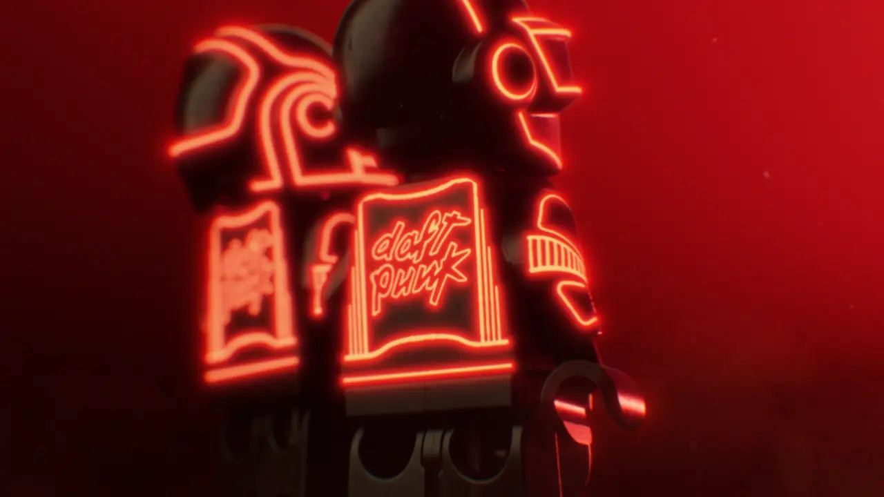 Red neon sign displaying stylised text and geometric shapes against a dark background