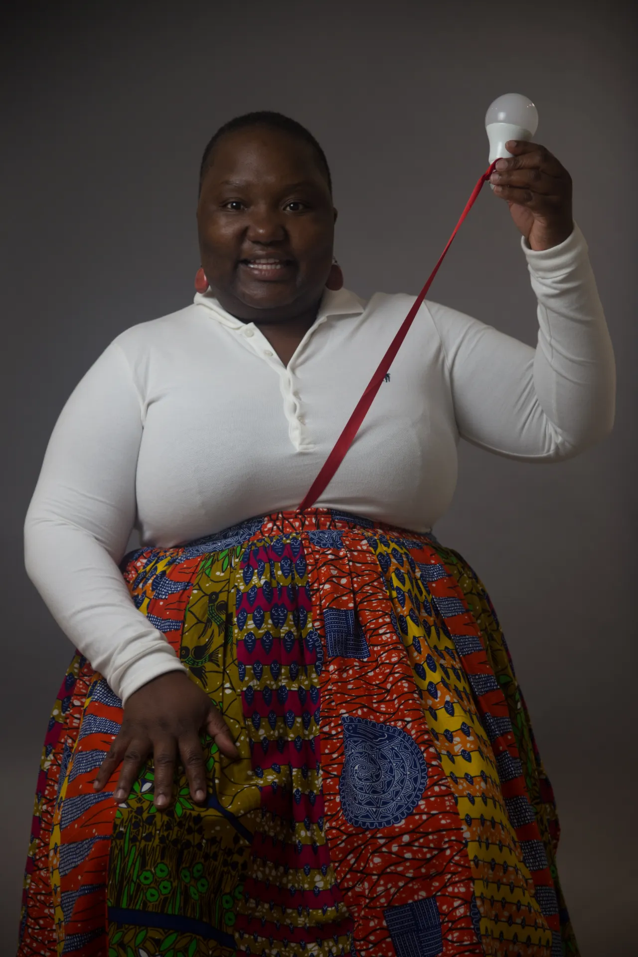 Yeukai Taruvinga Thamesmead, 2018 Scarlett Crawford, 2018. “Yeukai feels we have made progress but as we still have many issues she fears for her children. Despite this, by using the ribbon to represent her umbilical cord and the lightbulb held up optimistically she demonstrate her hopes for the future.” © UK Parliament