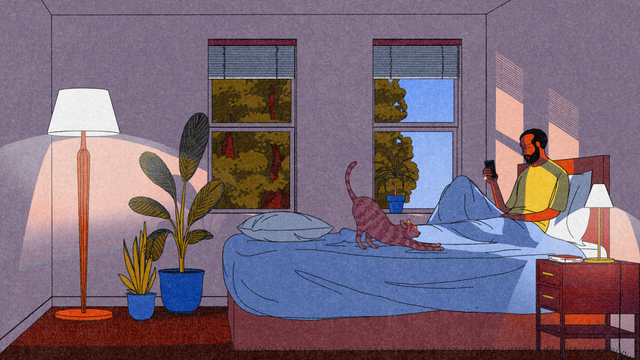 Woman sitting on unmade bed in purple bedroom with potted plants, floor lamp and windows showing trees outside