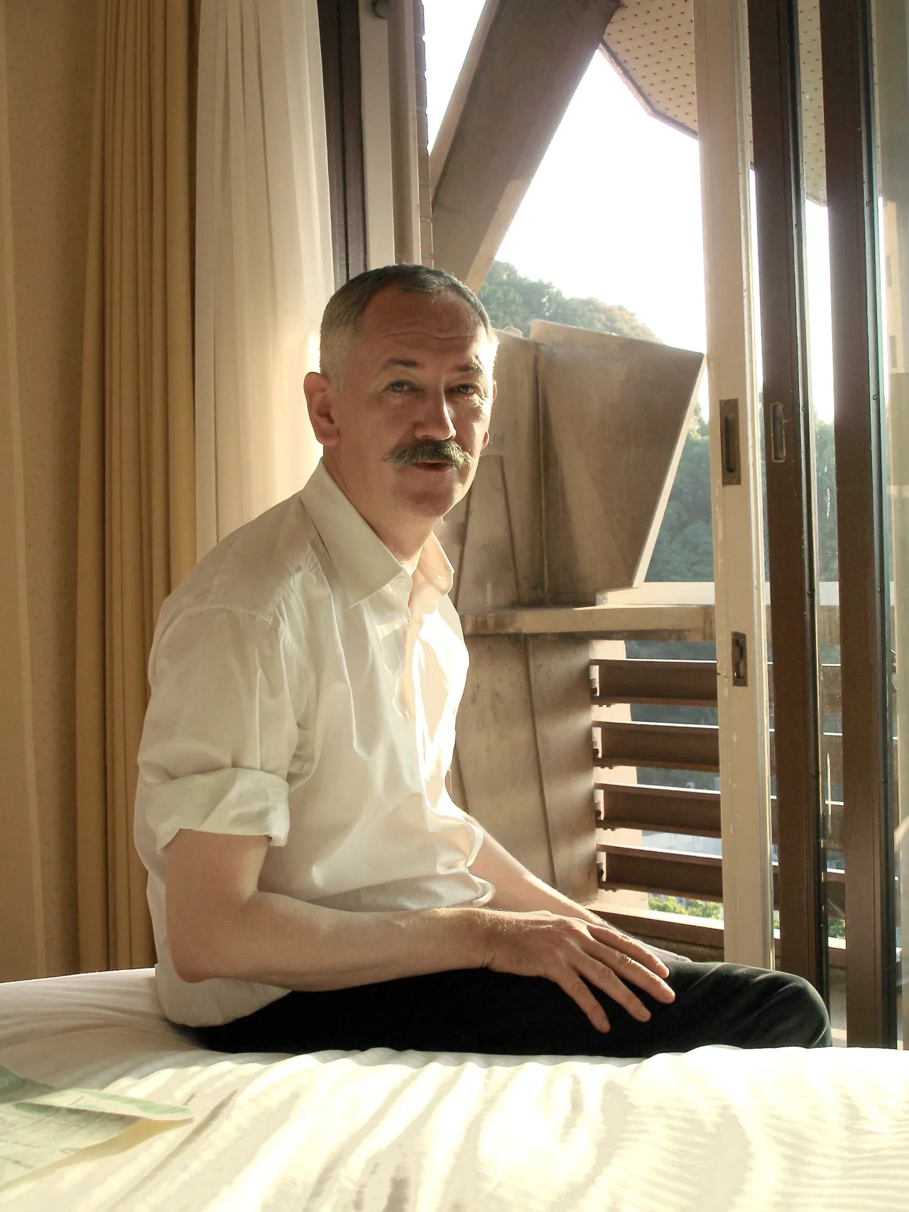 Portrait of Cerith Wyn Evans. Courtesy of the artist
