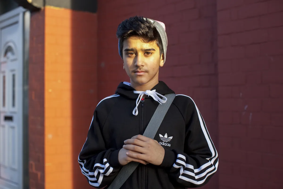 Mahtab Hussain Young boy in pink and grey beanie  from the series You Get Me? 2014 Courtesy of the artist