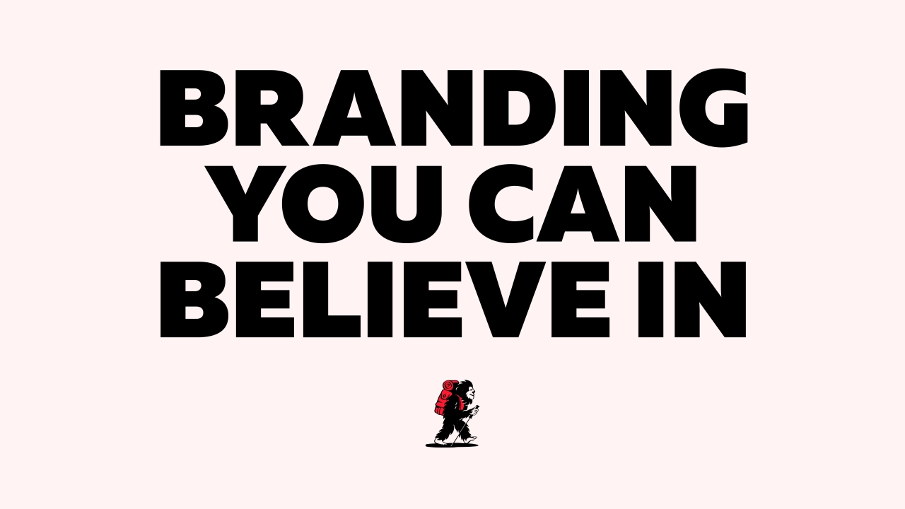 Bold text reading "Branding you can believe in" with a small red and black geometric logo beneath on a pale pink background