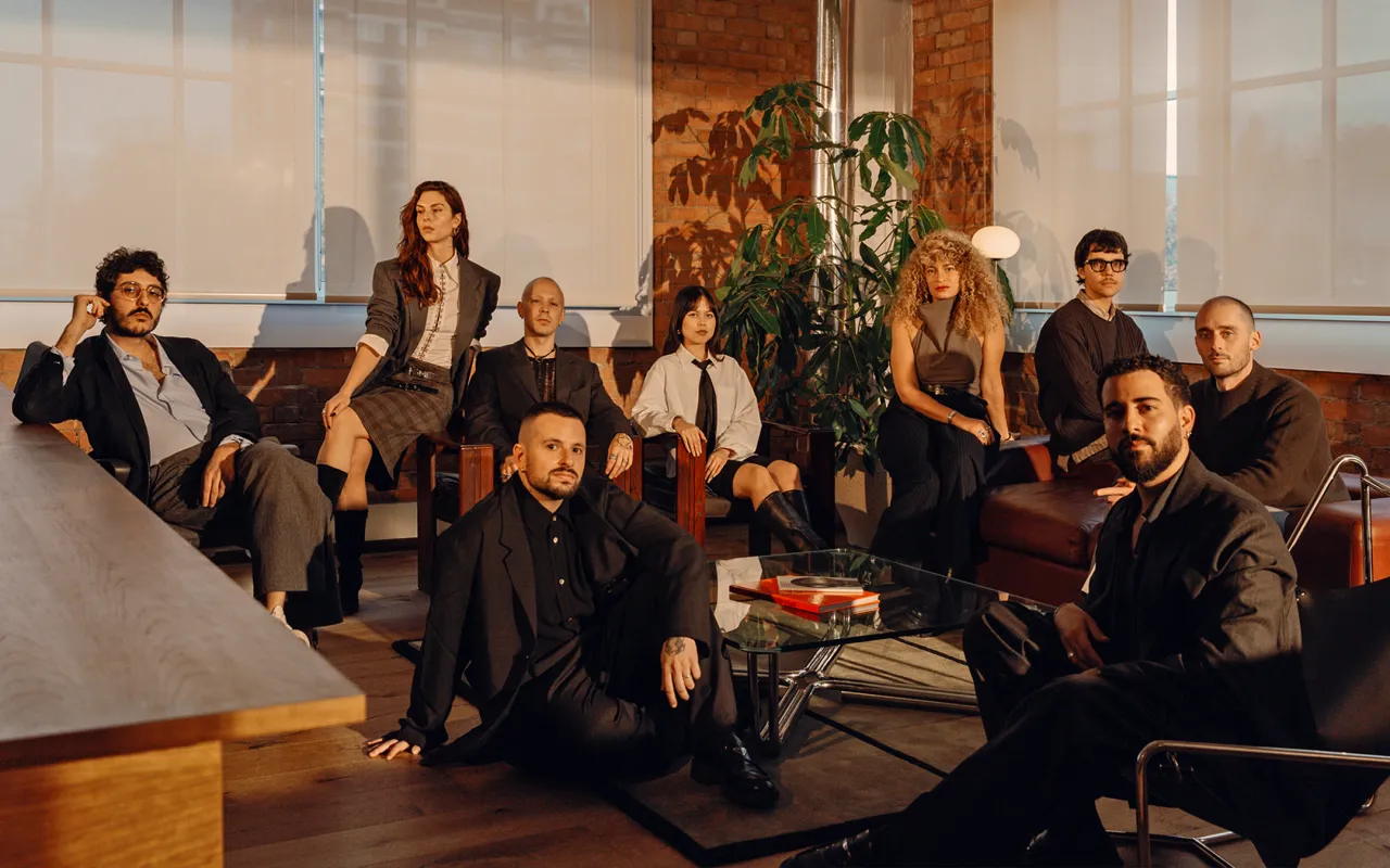Brazilian co-founders Leo Porto and Felipe Rocha, and their team