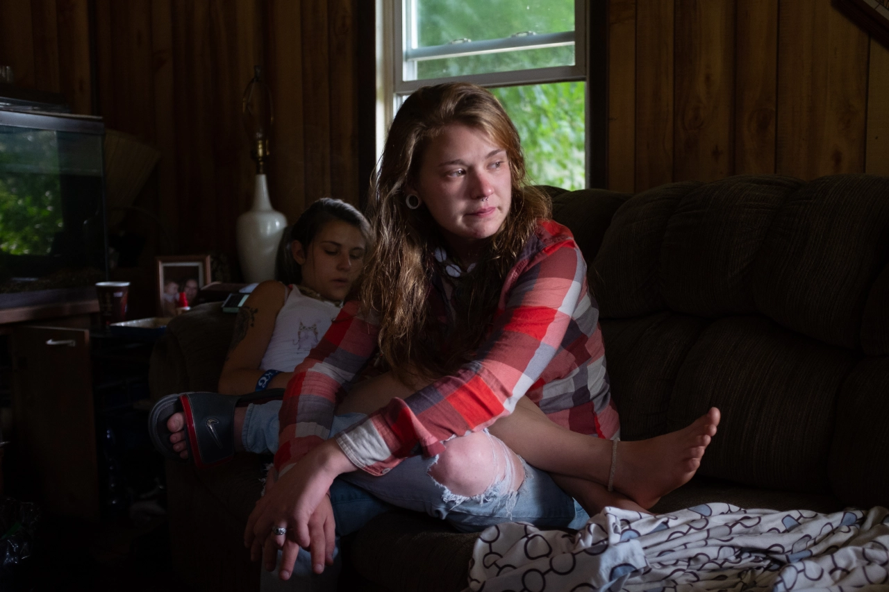Allie crying, facing jail time and missing Barbie who died of an overdose, after a long night of using. © Mark E. Trent