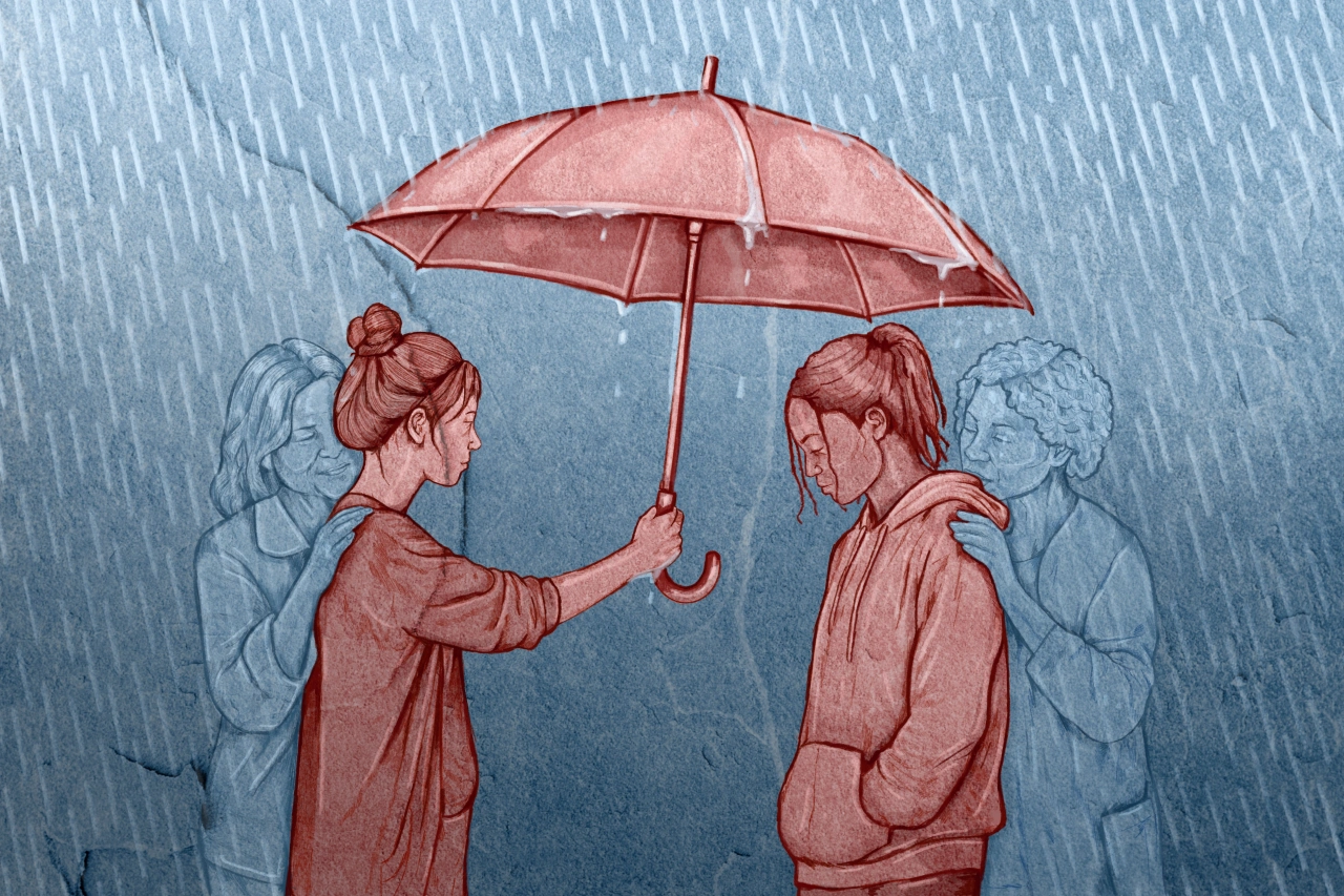 Woman holding a pink umbrella over a boy in the rain, with faded figures visible behind them