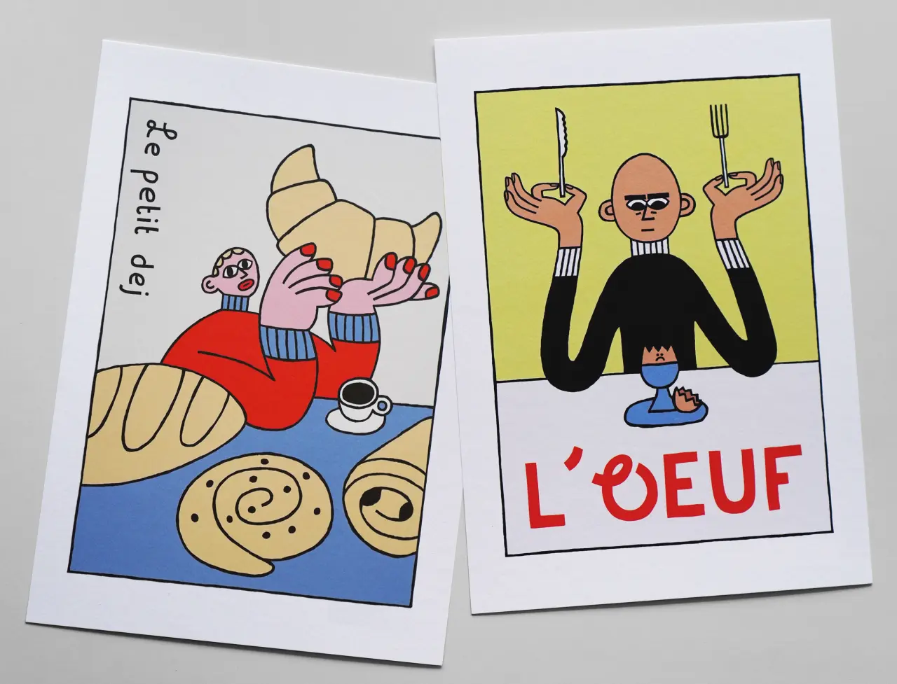 Two illustrated prints: left shows a figure with blonde hair enjoying pastries and coffee labelled "le petit dej"; right depicts a bald character holding cutlery above a plate labelled "L'OEUF