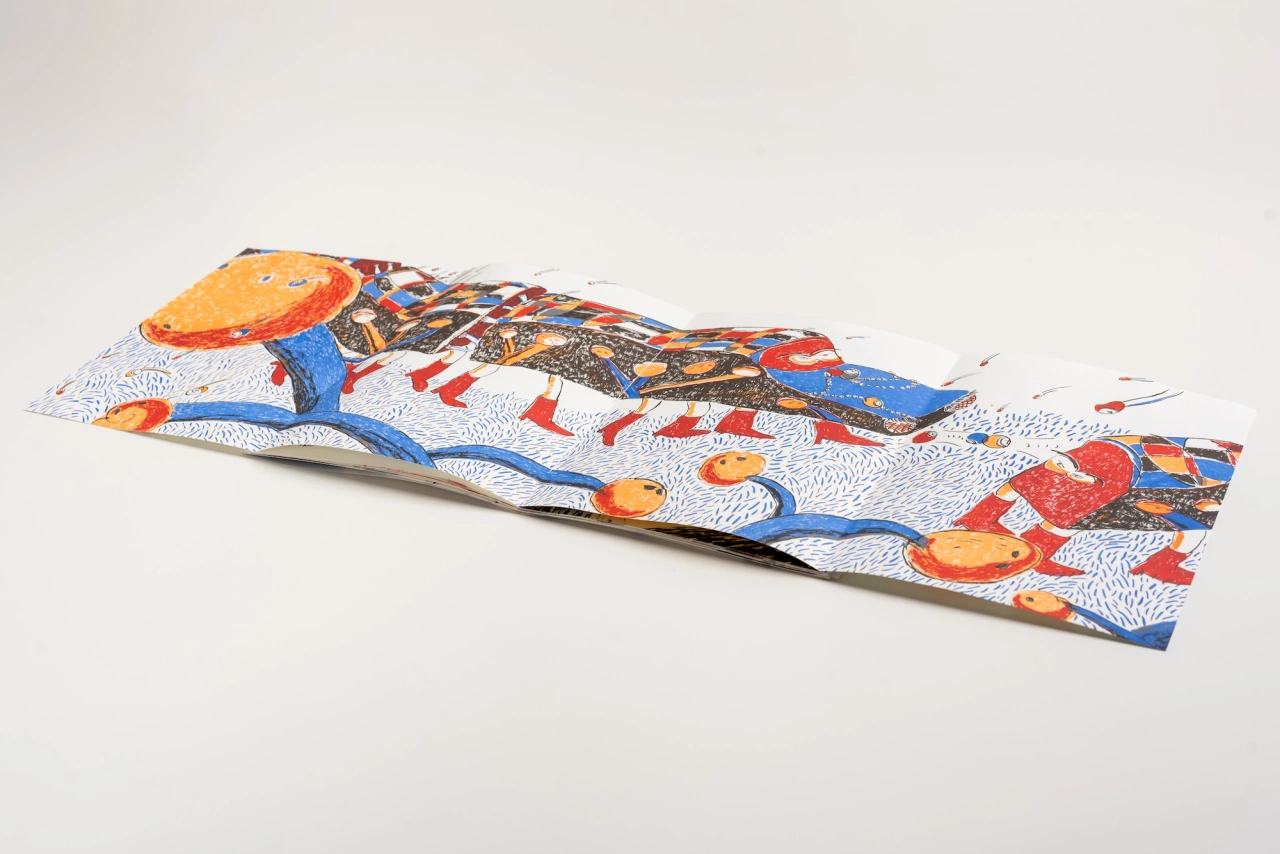 Rolled fabric artwork with vibrant blue, orange and red patterns titled Westward 3, featuring abstract shapes and textured designs against a white background